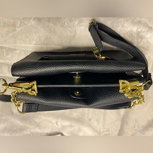 Steve Madden purse, black, gold detailing, two pockets, cross body and hand bag